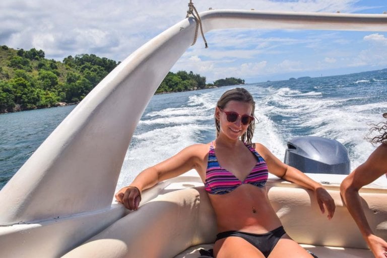 Bailey sits back on our boat tour around Ilha Grande, Brazil