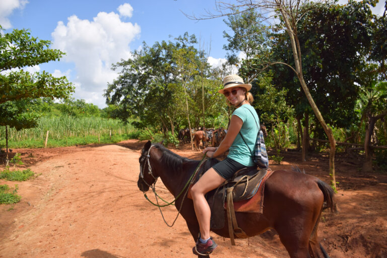 bailey riding a horse in vinales, cuba