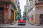 and old car in an old street in Cuba