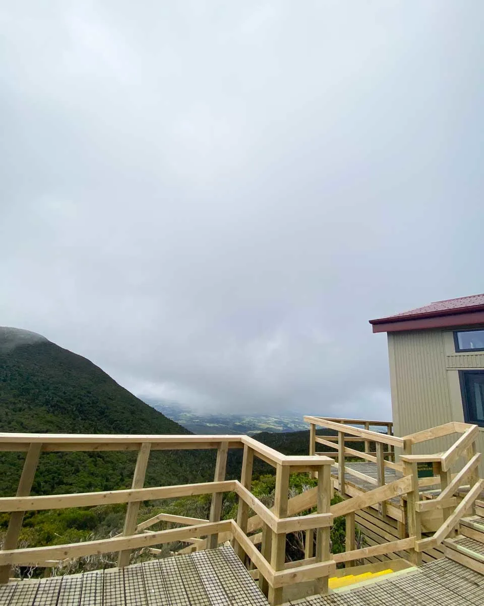 The outside of the Pouakai Hut on a cloudy day