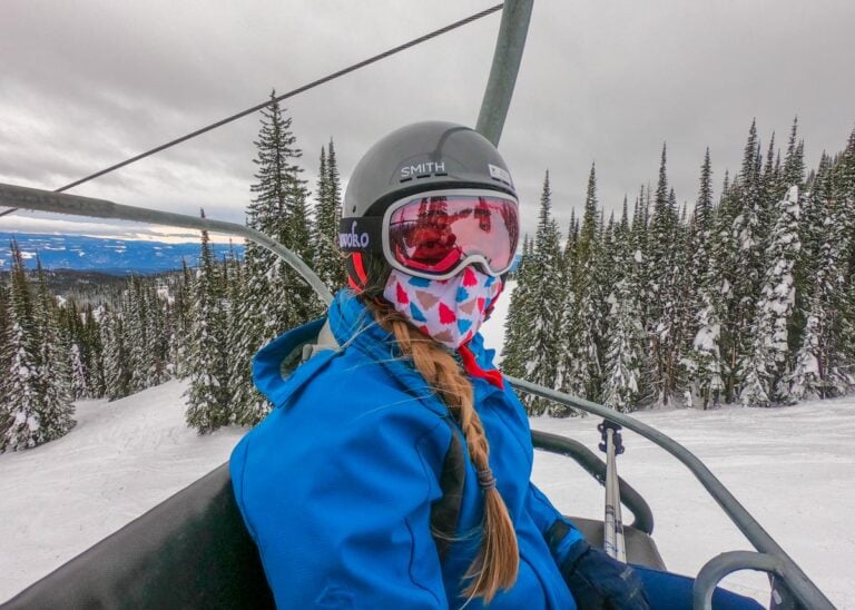 A lady on a chairlift at Big White Ski Resort near Kelowna, BC in winter