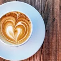 A coffee on a table from a Kelowna Coffee shop