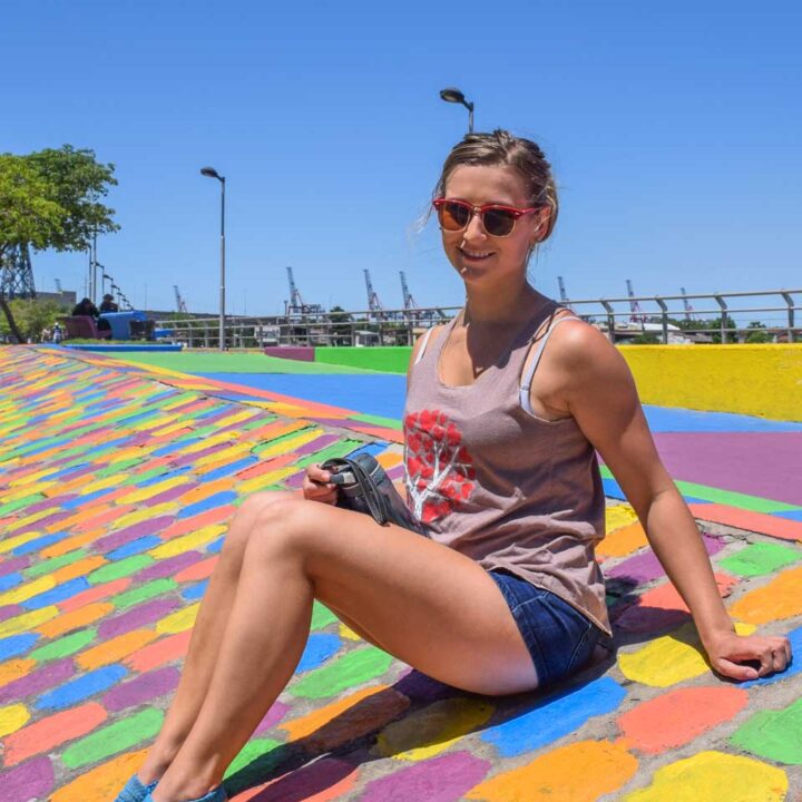 Bailey sits on the colorful streets of La Boca, Buenos Aires