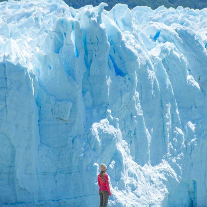 Bailey appears tiny in contrast to the face of the Perito Moreno Glacier