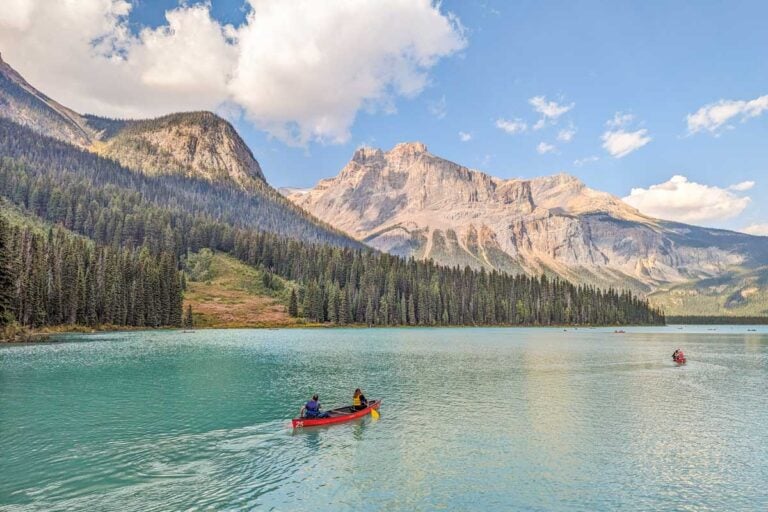 Two people canoe at Emerald Lake in Yoho National Park