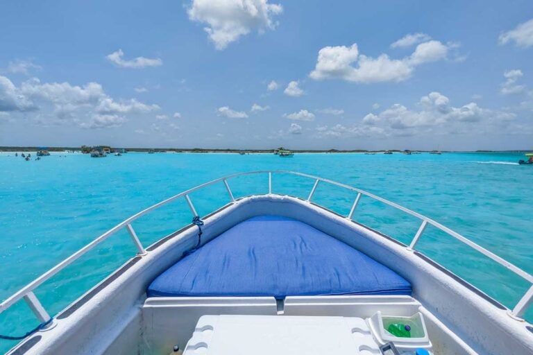 View out the front of our boat on our Bacalar boat tour of the beautiful blue water
