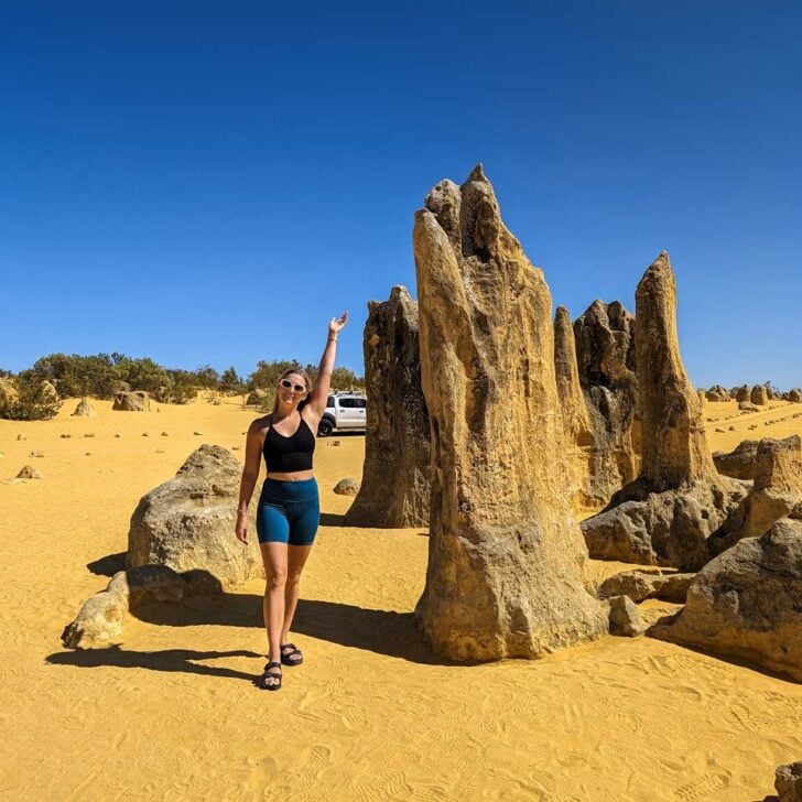 Bailey stands by a pinnacle in Australia