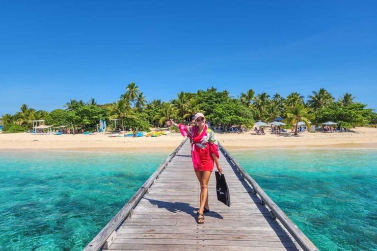 Bailey walks along the jetty to Malamala Beach Club from the boat