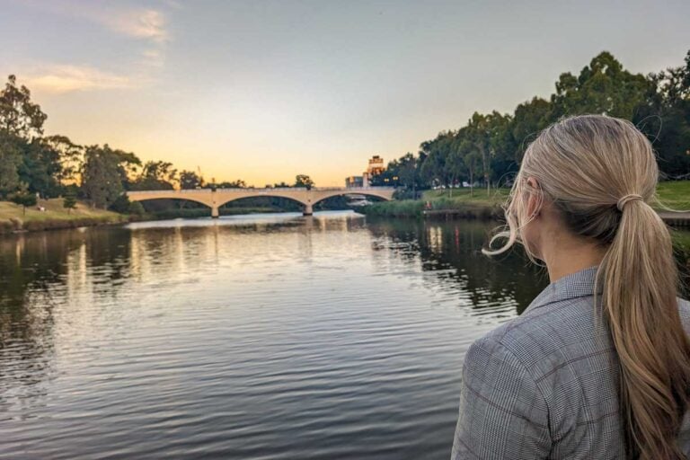 Bailey looks out over the water during sunset during the spirit of melbourne dinner cruise