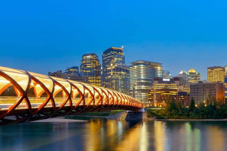 Peace Bridge at night over the Bow River in Calgary AB Canada