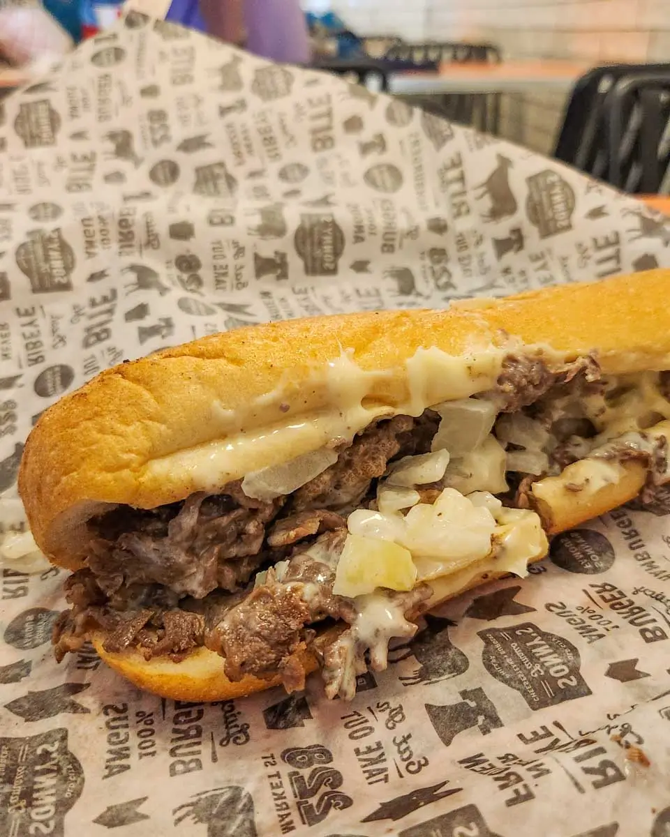 A philly cheesesteak eaten in a shop in Philadelphia, Pennsylvania
