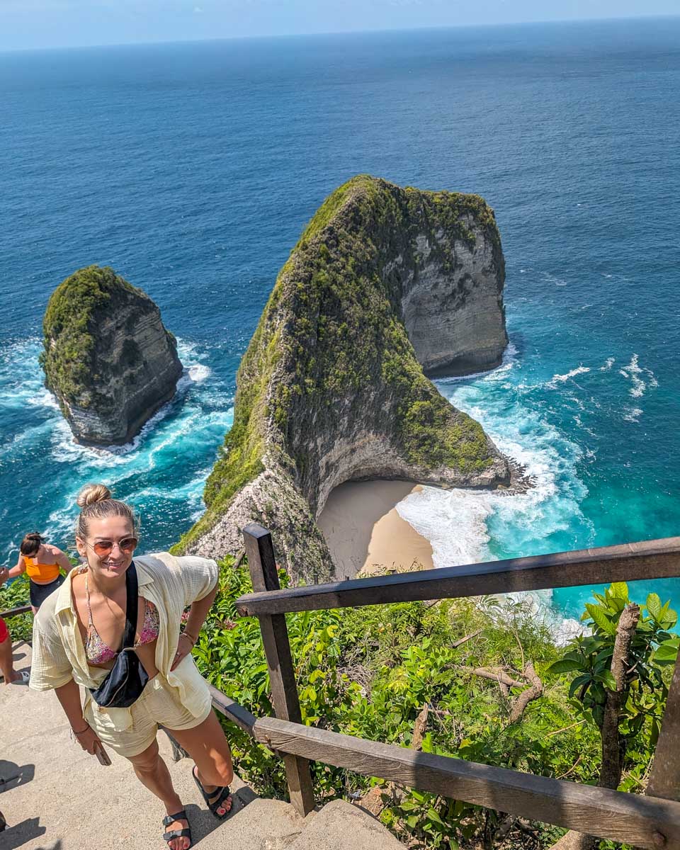 Bailey on stairs looking down at Kelingking Beach on a Nusa Penida tour in Bali