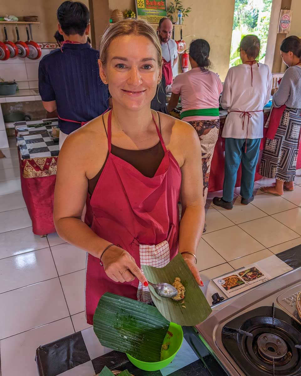 Bailey-wraps-food-in-banana-leaves-during-a-cooking-class-in-Panama City Panama