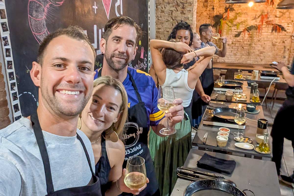 Daniel and Bailey smiling in a kitchen during a Paella making class in Barcelona Spain
