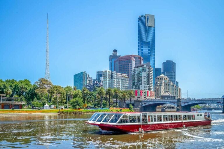 A river cruise and Melbourne skyline in Australia on a sunny day