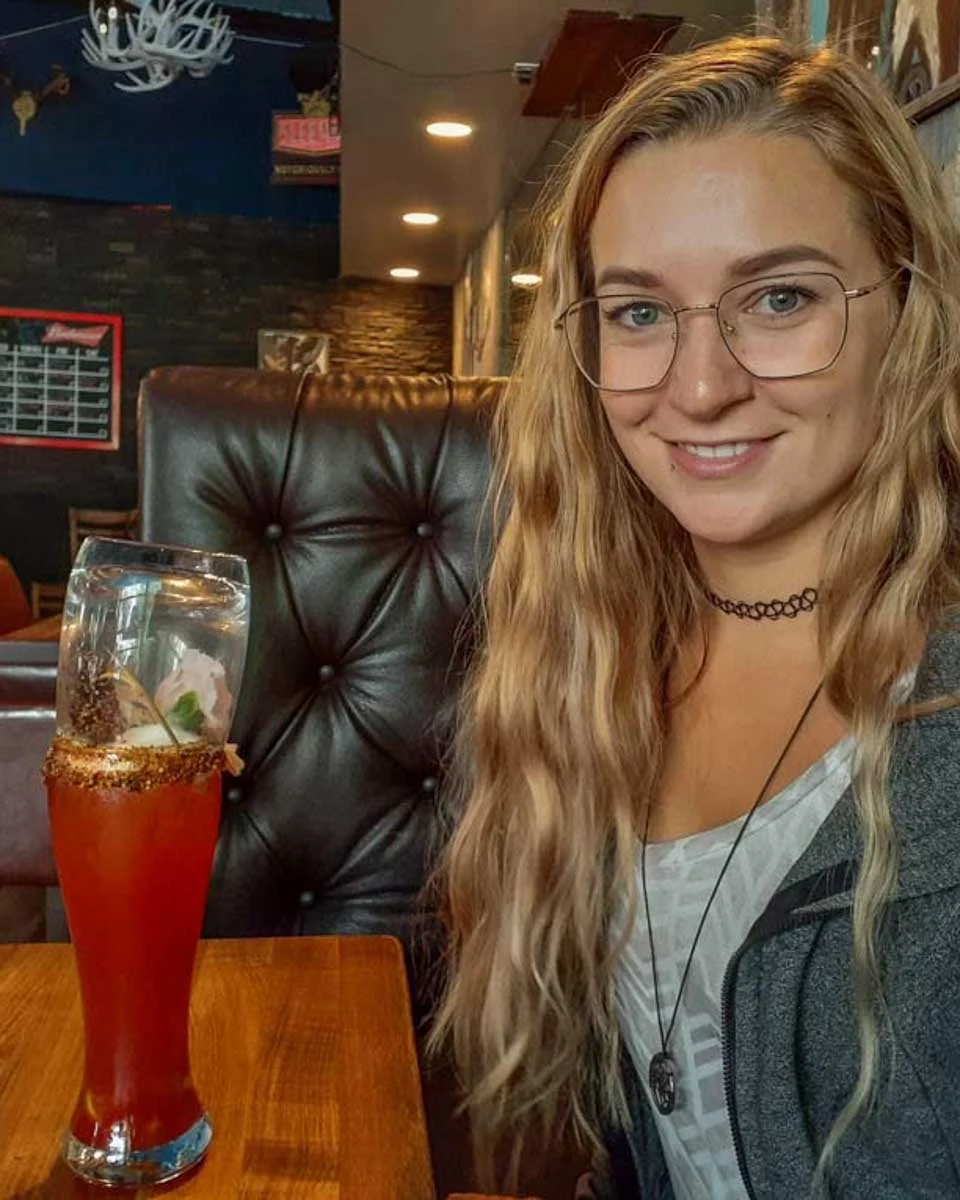 Bailey drinks a ceasar in Banff Canada ona food tour