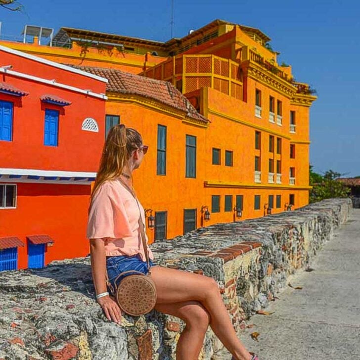 Bailey-sits-on-the-fort-wall-in-Cartagena-Colombia