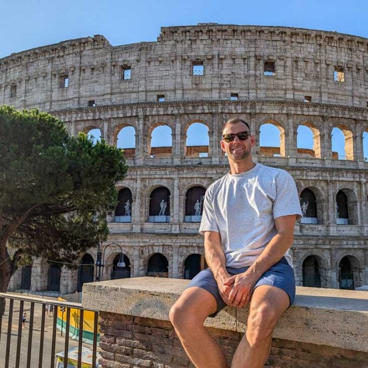 Daniel sitting outside of the colosseum in Rome Italy-2