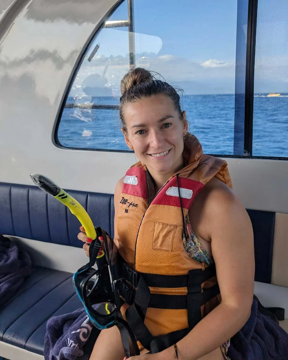 Bailey-on-a-boat-to-go-snorkeling-with-dolphins-on Oahu Hawaii
