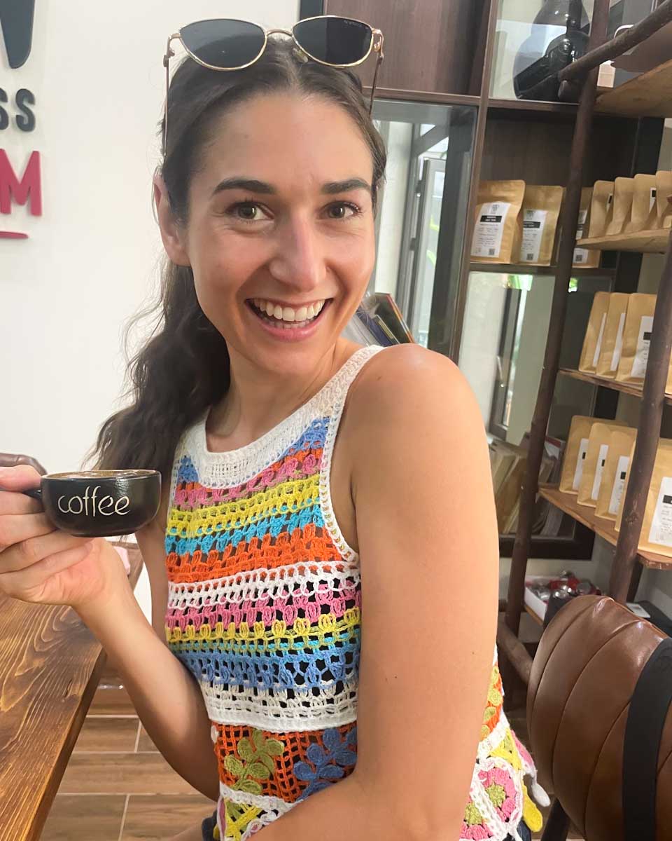 Brittni drinks coffee she made during a class in Hanoi