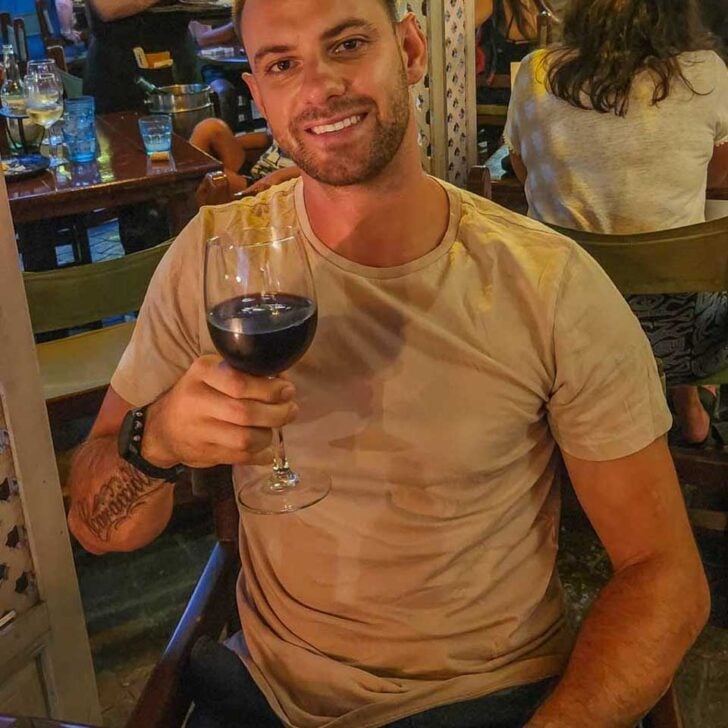 Daniel-enjoys-a-glass-of-wine-on a tour in Madrid Spain
