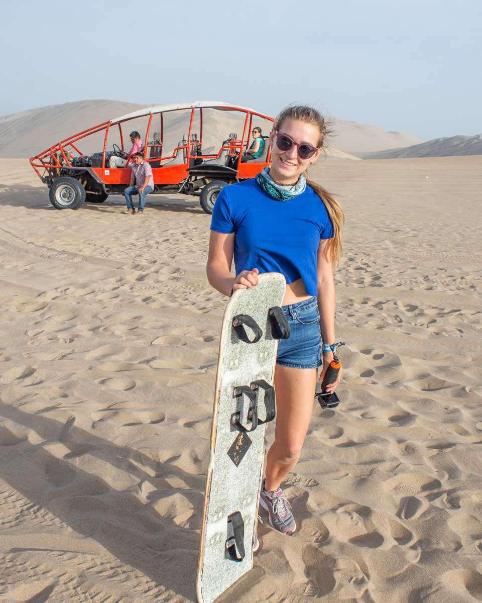 Bailey-poses-with-the-dune-buggy-and-sandboard-in-near Cairo Egypt