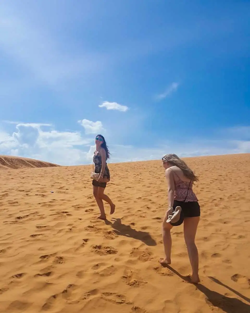 Brittney at red sand dunes with her friend in Ho Chi Minh, Vietnam