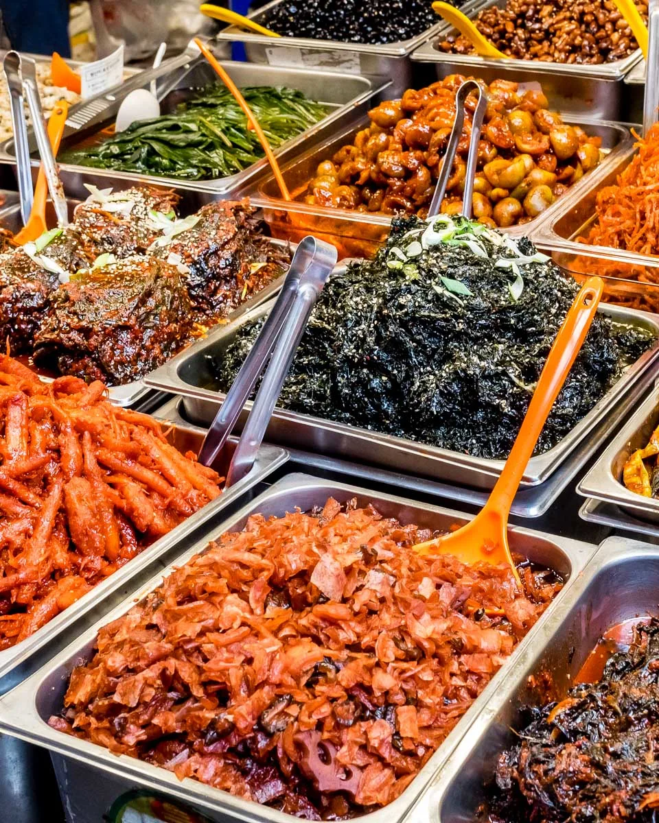 Various foods at traditional Gwangjang Market in Seoul South Korea on a food tour