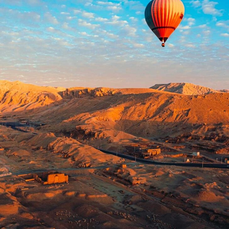 A-hot-air-balloon-flies-at-sunrise-in-Luxor-on-a-cruise-to-Luxor-Egypt from Aswan
