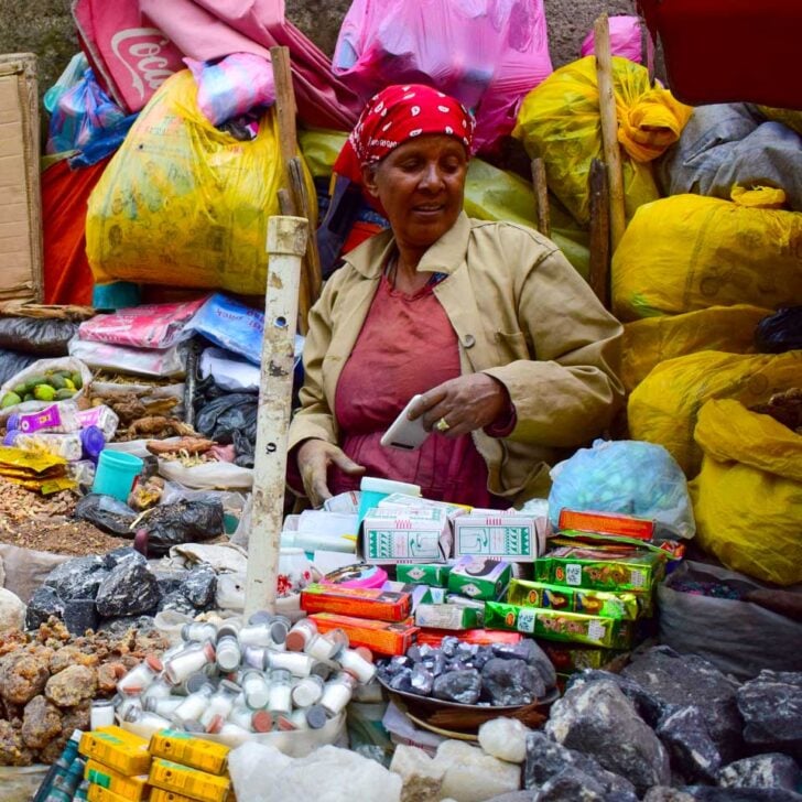 A woman sits at the Merkato Market in Addis Ababa Ethiopia