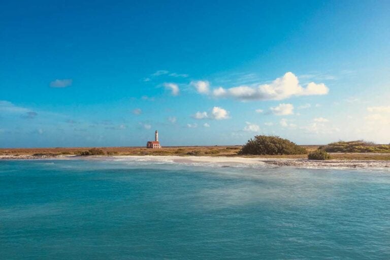 Klein Island and lighthouse seen on a tour from Curacao on a sunny day