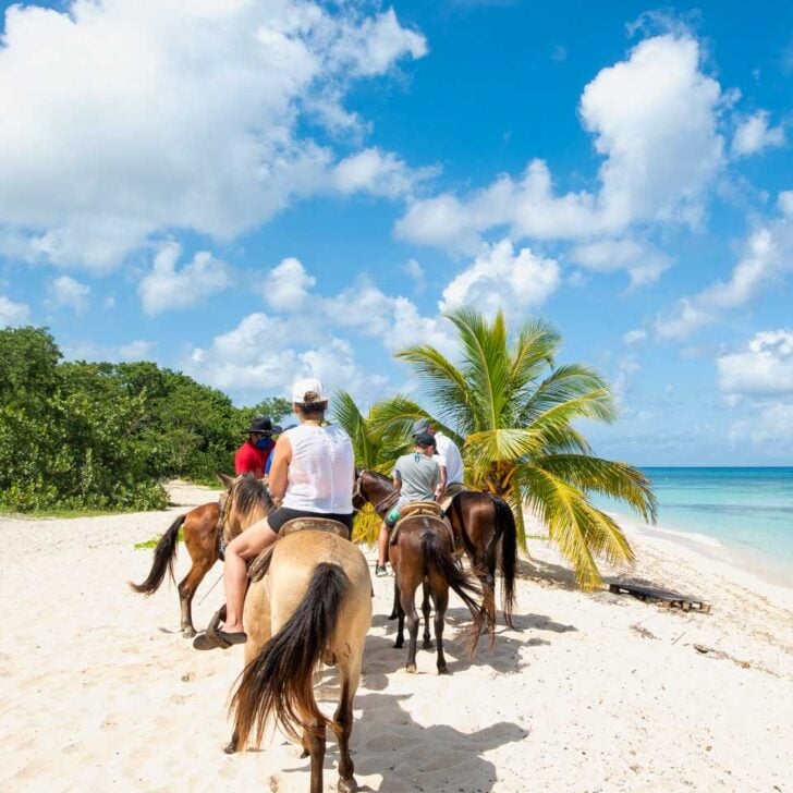 Looking-at-people-riding-horses-on-the-beach-in-Ocho Rios Jamaica