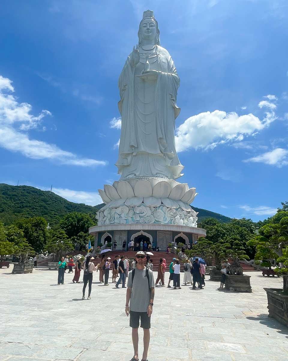 Our friend standing in front of the Lady Buddha in Danang Vietnam