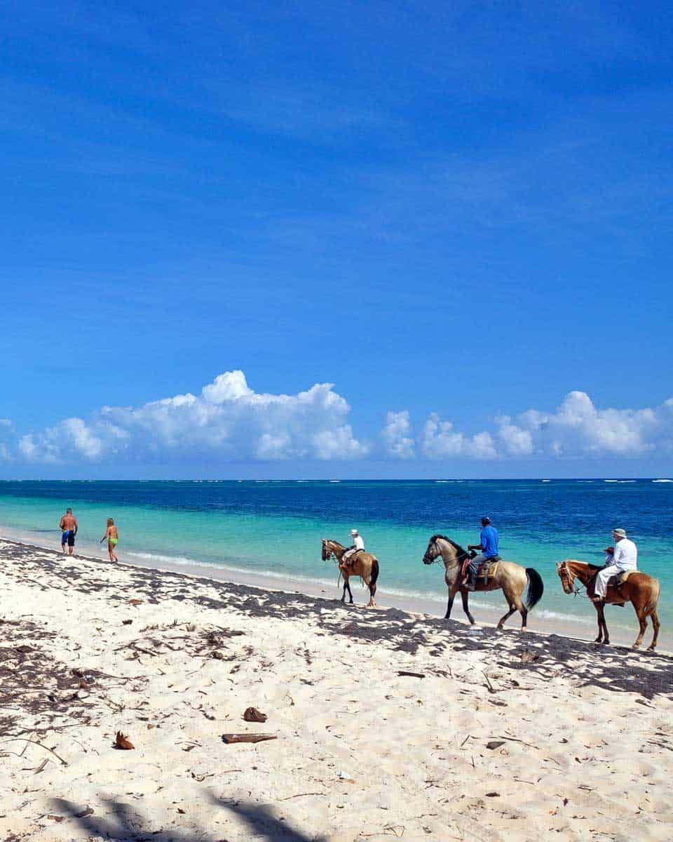 People-ride-horseback-on-a-beach-in-MOntego Bay Jamaica