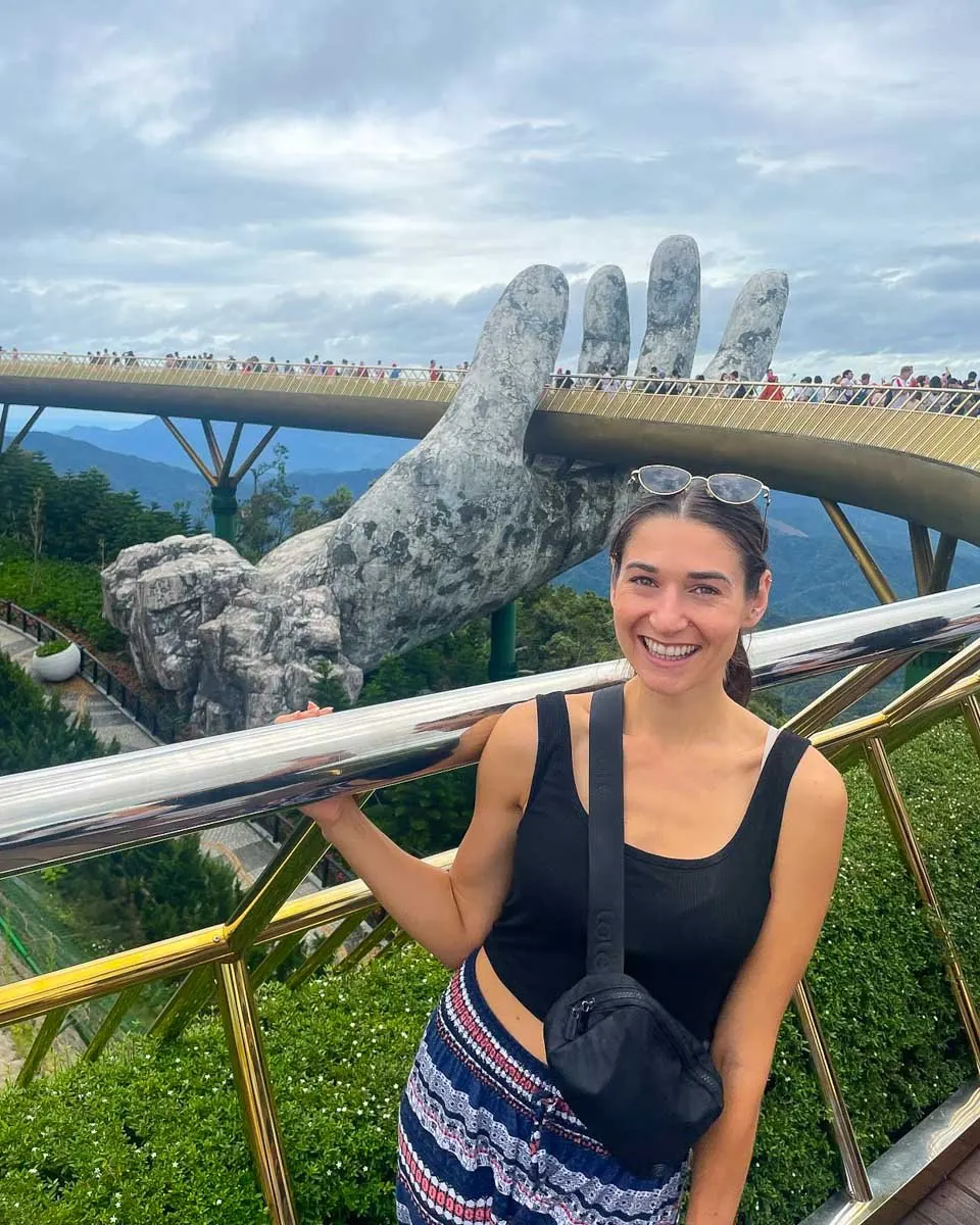 Posing in front of the Golden Hand Bridge at Ba Na Hills Vietnam