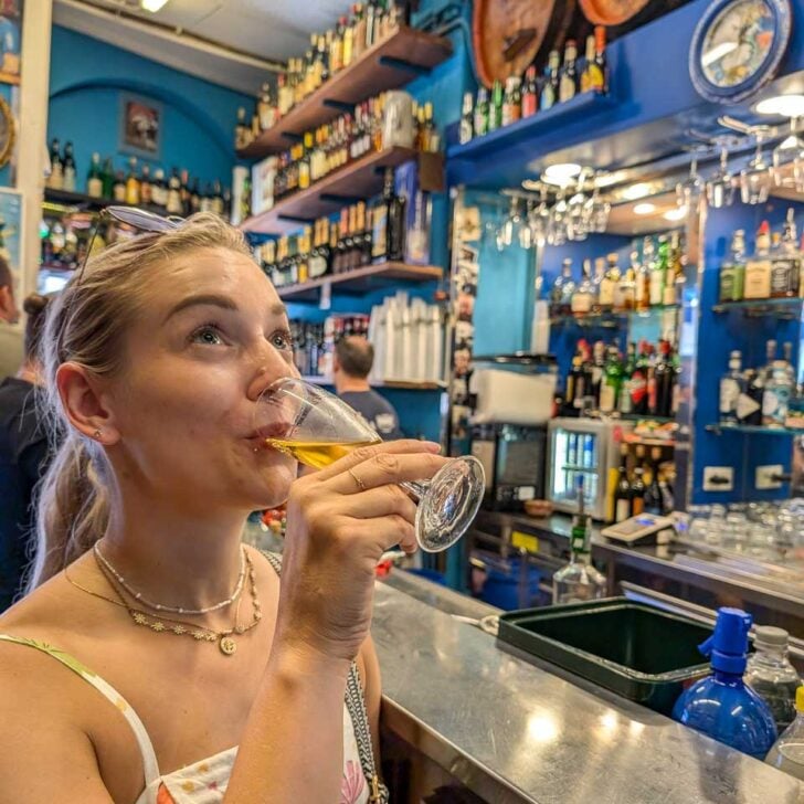 Bailey-drinks-wine-on-a-food wine history tour in Verona Italy