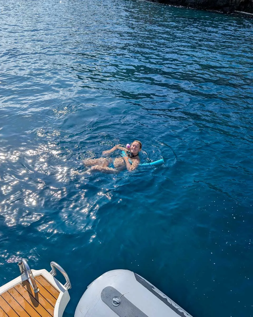 Bailey-swims-on-a-boat-tour-in the Aegadian Islands on a tour from Sicily Italy