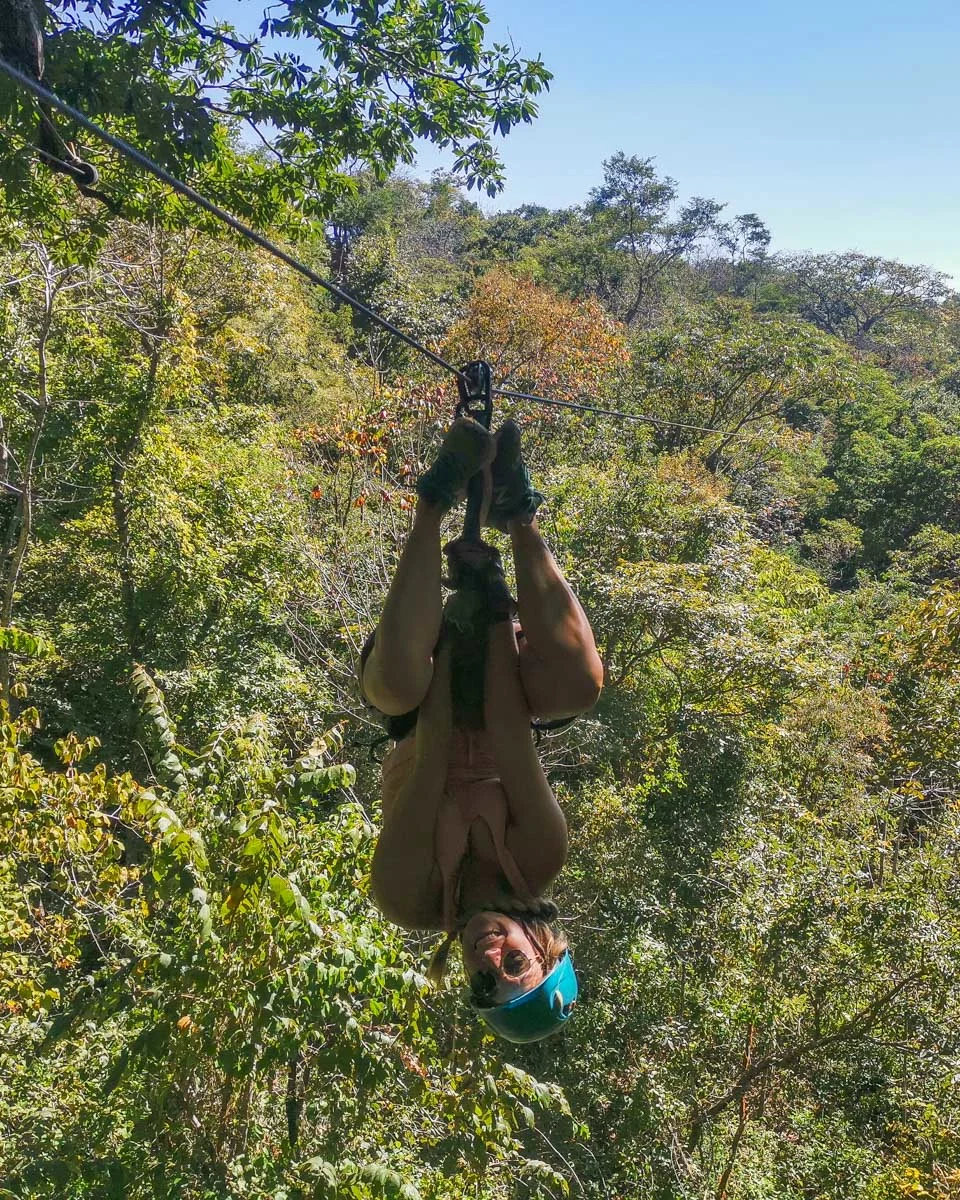 Bailey-upsidedown-on-a-ziplining-course-in-Big Island Hawaii