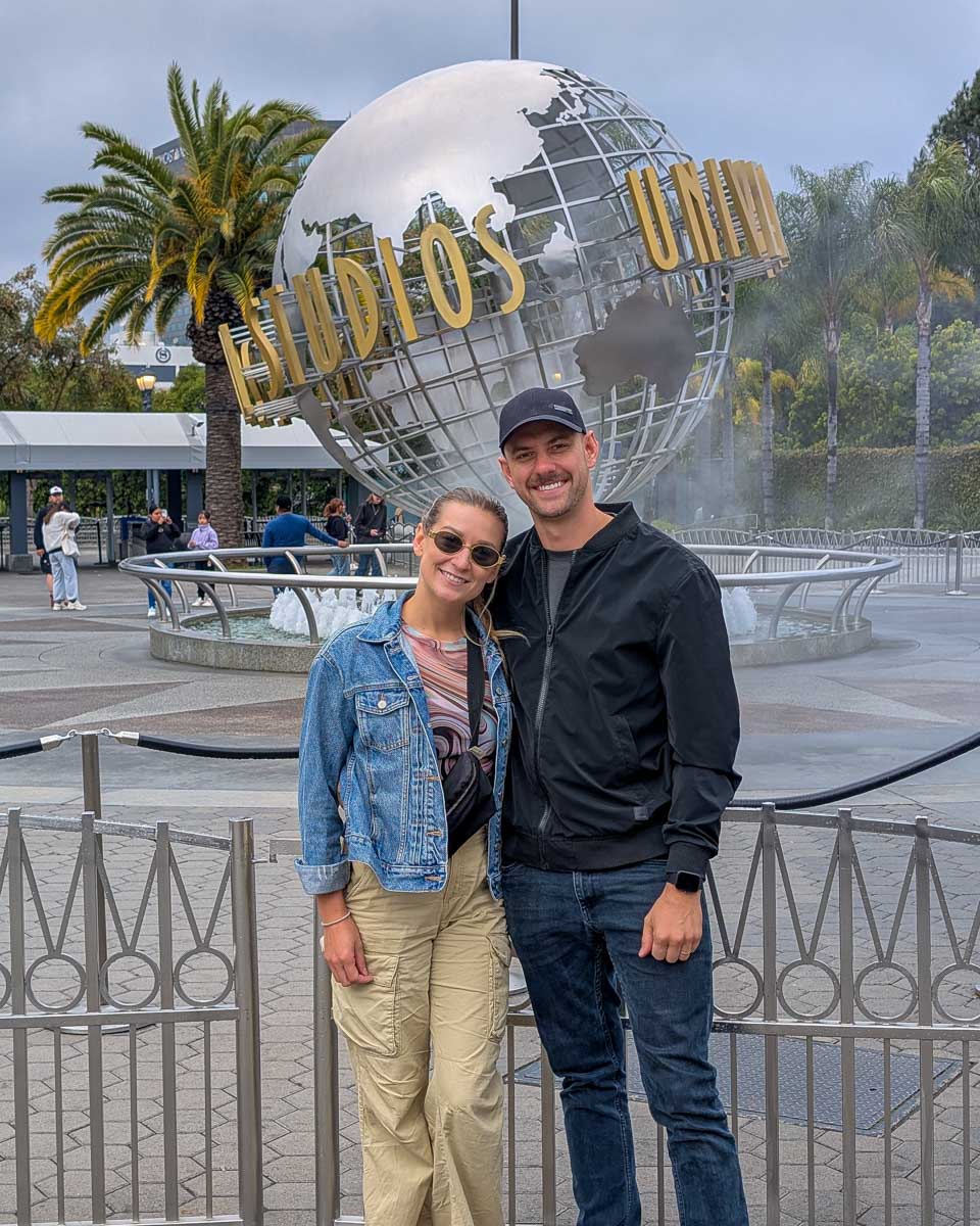 Daniel and Bailey in front of the Universal Studios Globe in Los Angeles California United States