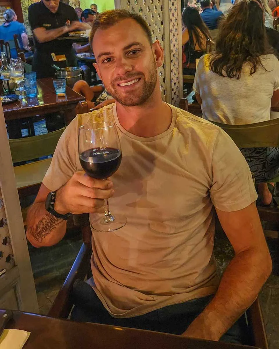 Daniel-enjoys-a-glass-of-wine-on a food tour in Split Croatia