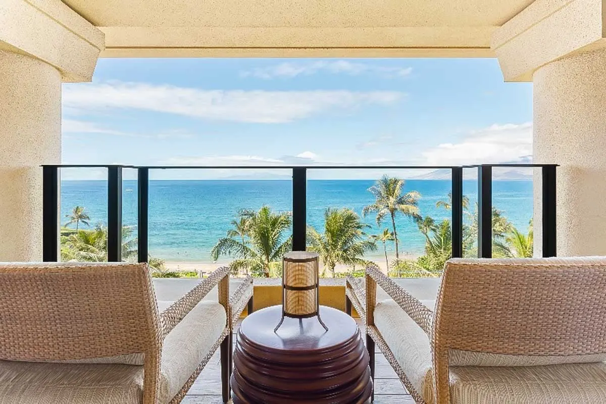 Hotel room balcony looking over the ocean at the Four Seasons Resort Hualalai Hawaii