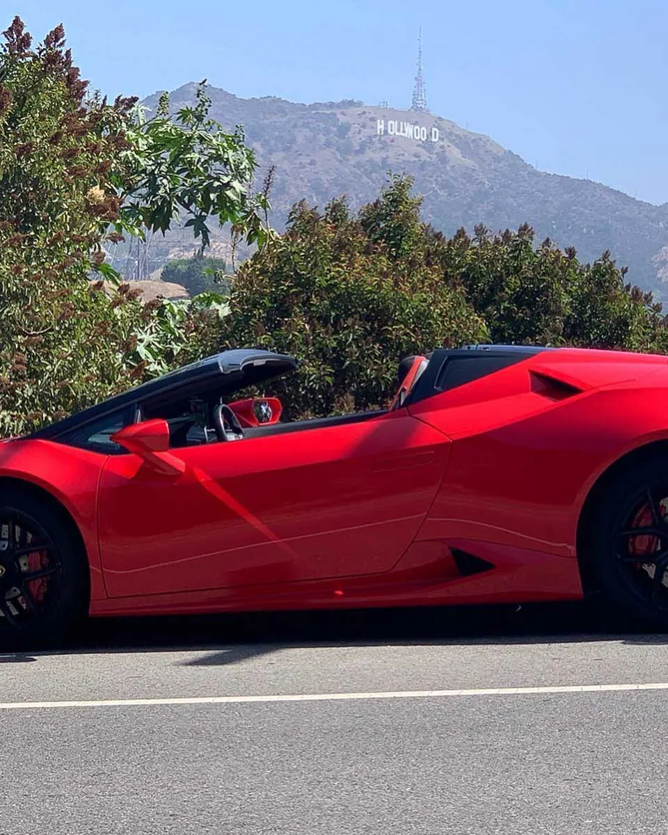 I Ride Like A Star car parked near the Hollywood sign in Los Angeles
