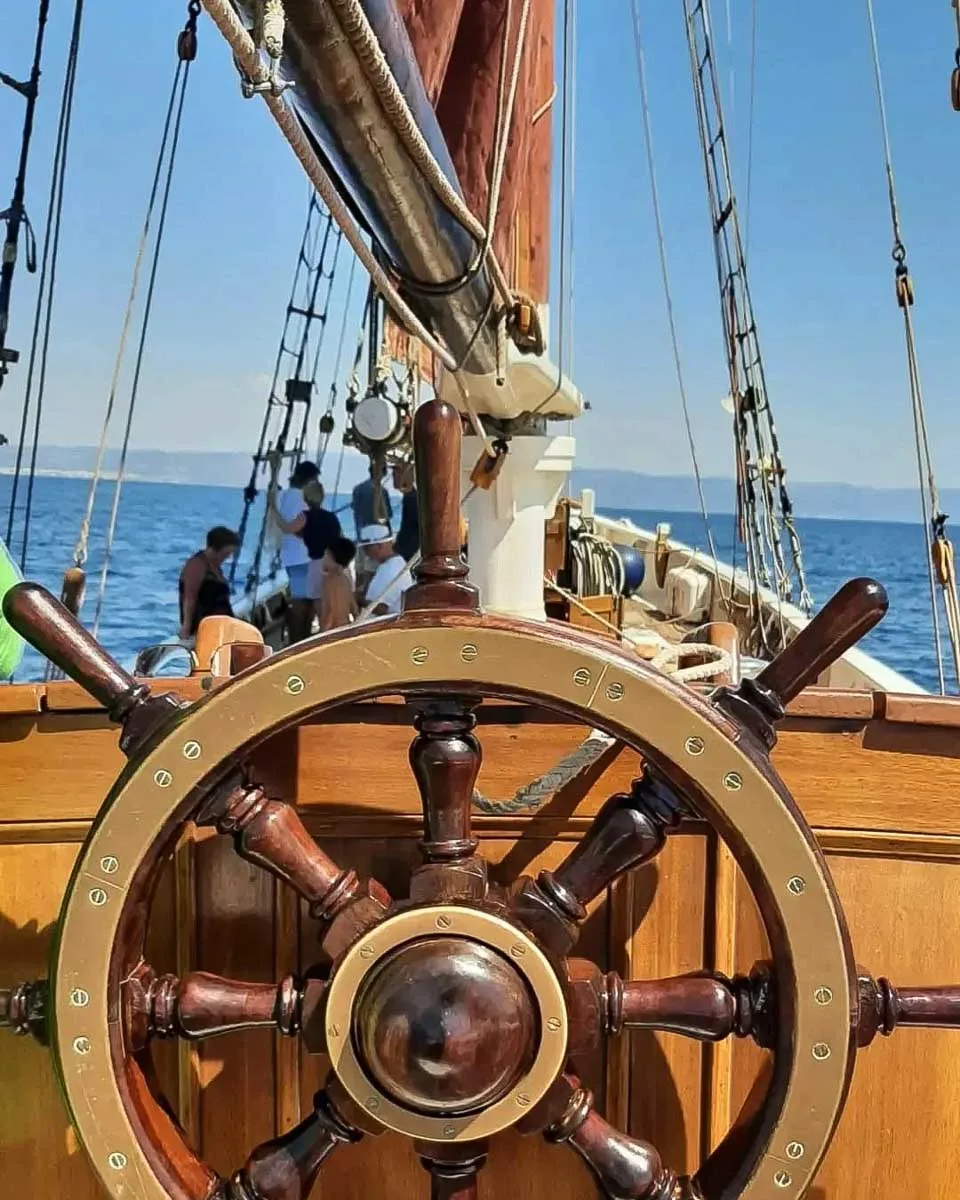 The helm of the sailing boat on a Andrea Jensen Sailing Tour in Sardinia Italy