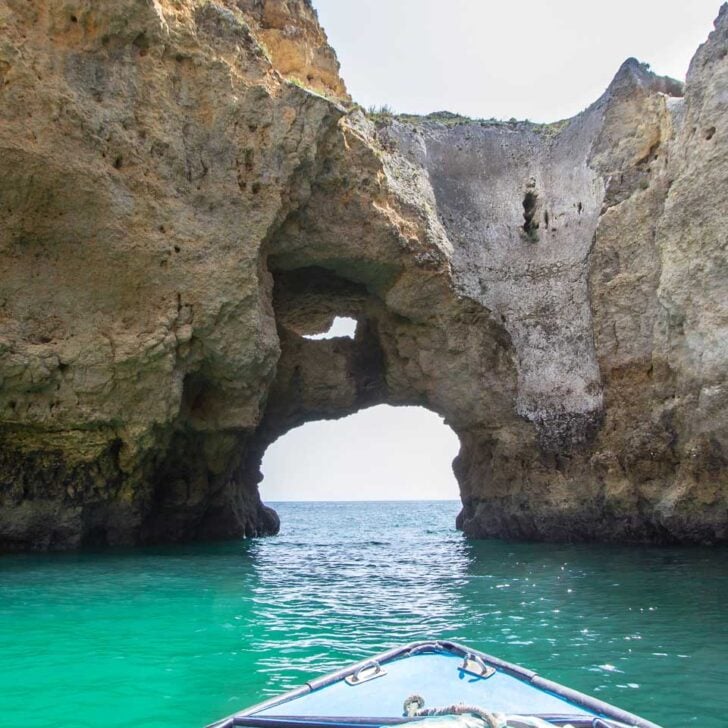 A boat heading through the Ponta da Piedade on a boat tour in Lagos Portugal