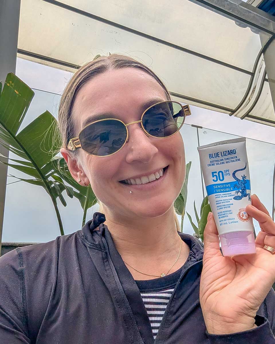 Bailey-holds-Blue-Lizard-sunscreen-in Santa Fe, New Mexico