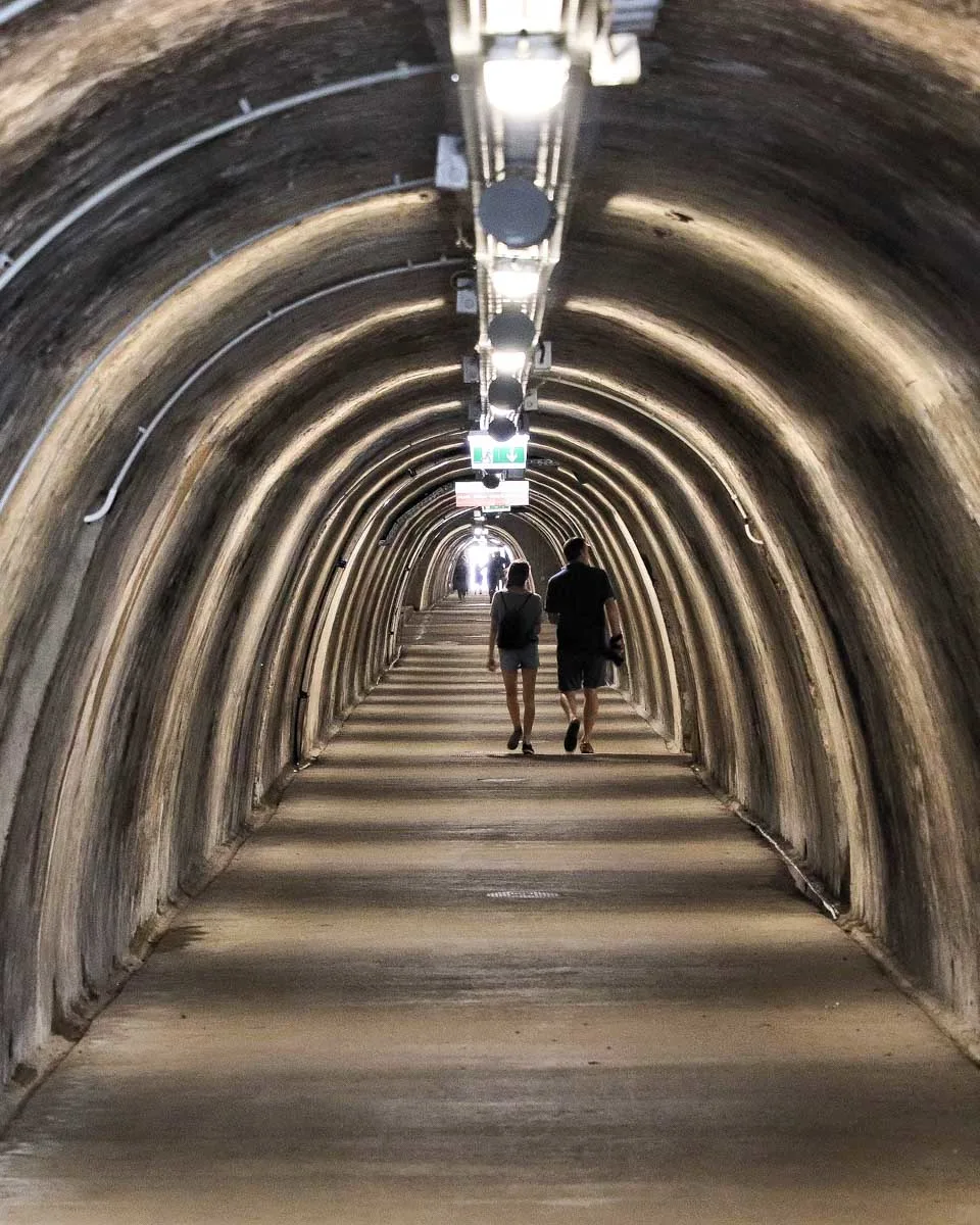 People walk down tunnel gric in Zagreb Croatia