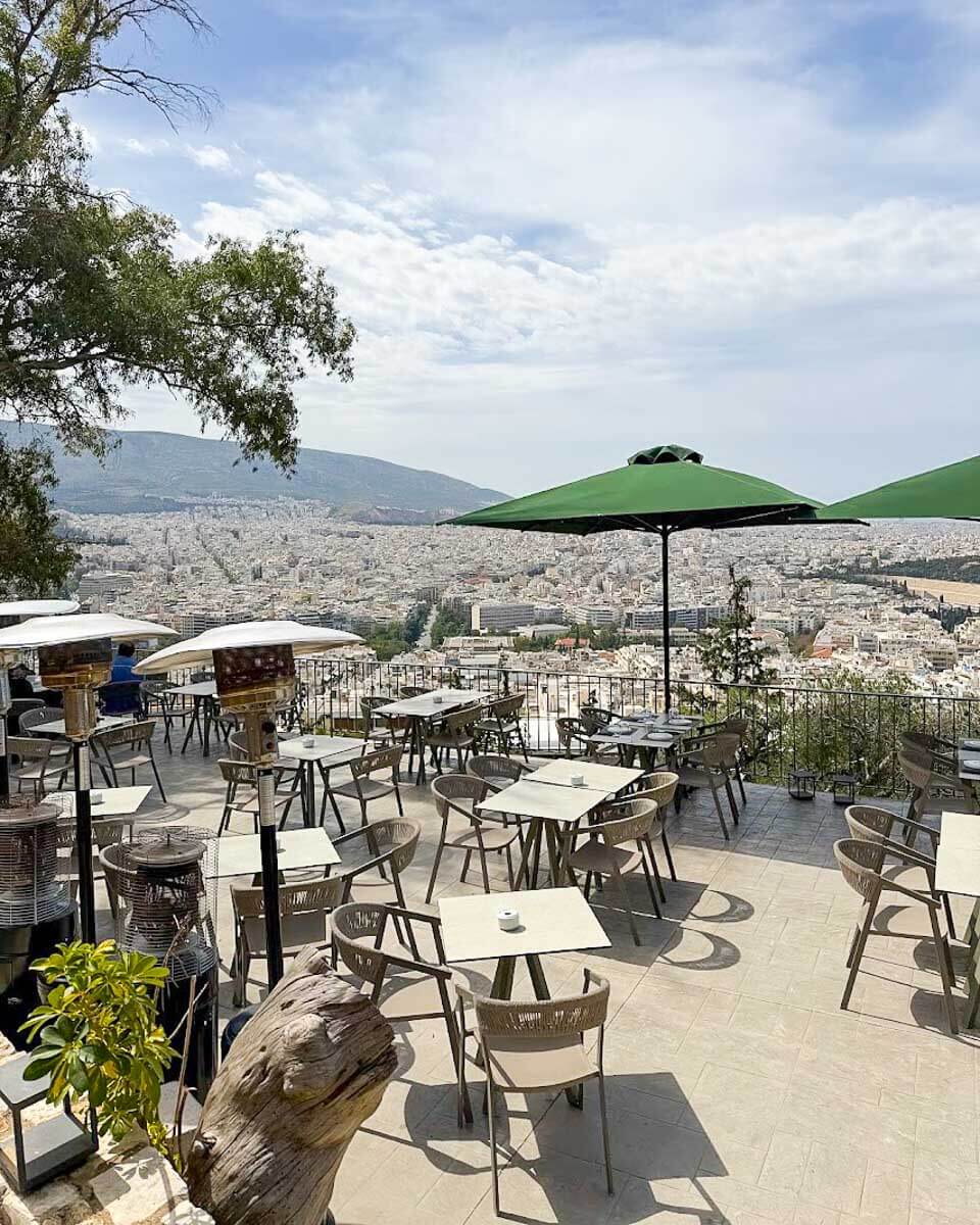 Outdoor terrace at Prasini Tenta on Lycabettus Hill overlooking Athens, Greece