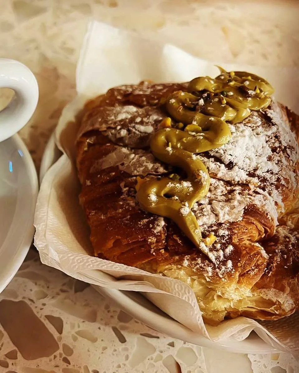 A cappuccino and cornetto at Mangia E Trevi Rome Italy