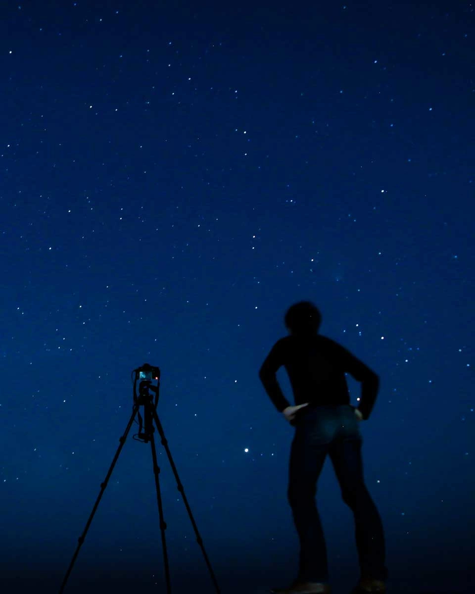 A-man-stargazing-in-the-desert-from-the Canary Islands