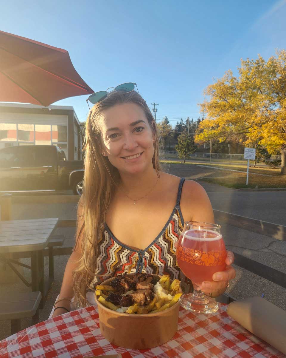 Bailey drinks a beer in Portland Oregon